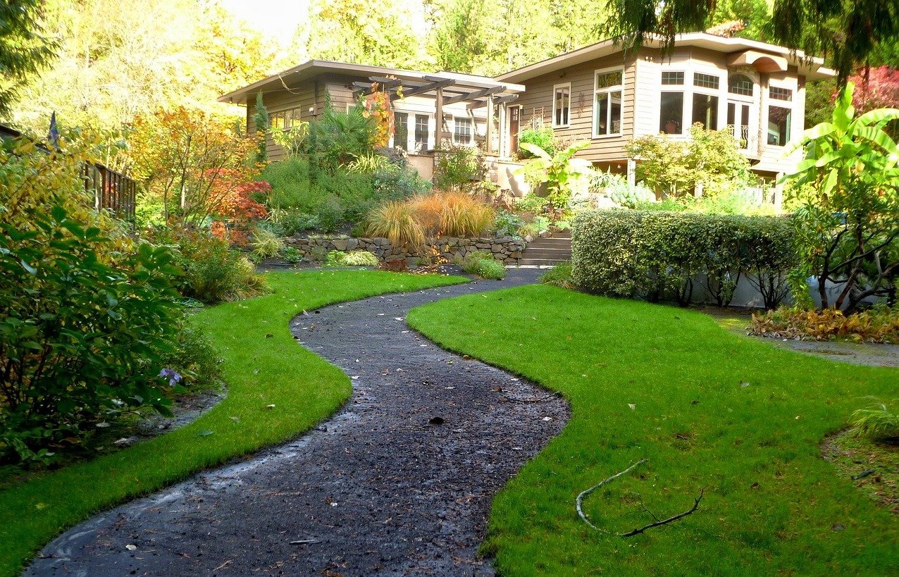 https://www.lawnstarter.com/blog/wp-content/uploads/2020/07/landscaped-path-house-shrubs-lawn-pixabay.jpg