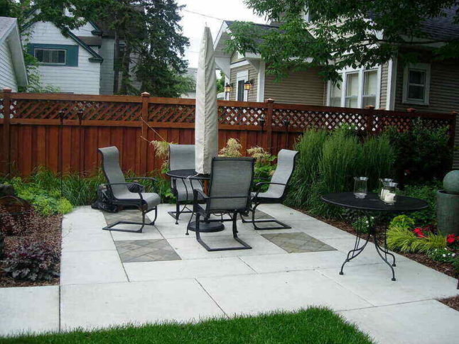 Concrete pavers patio with a table and chairs