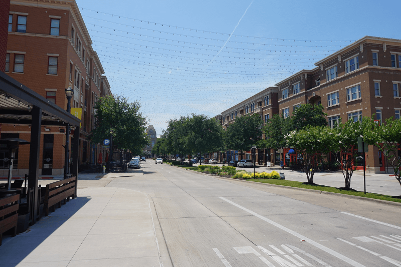 A quiet street filled with apartments in Frisco, Texas.