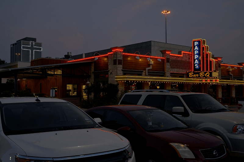 A glowing sign welcomes hungry guests to Pappas Bar-B-Q in Houston