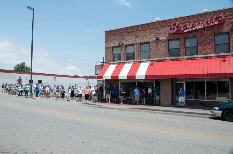 A line forms outside of Arthur Bryant’s Barbecue in Kansas City, Missouri