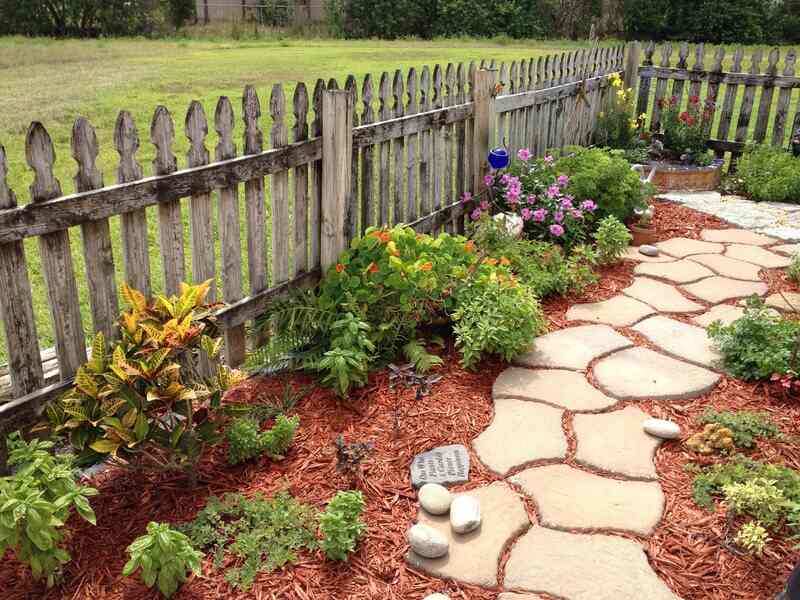 photo of a garden with a path and mulch