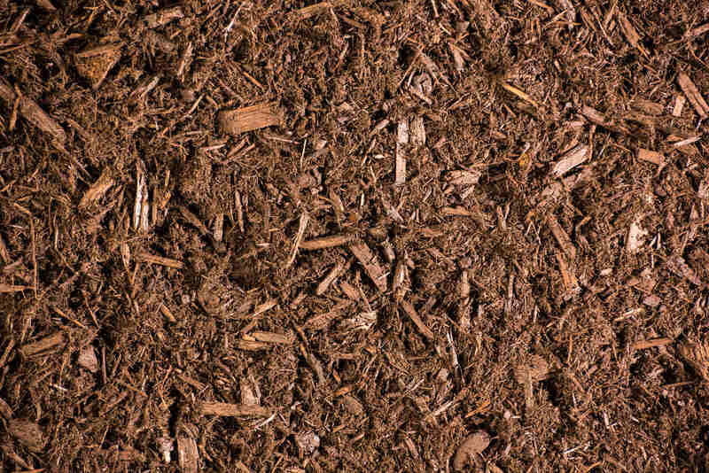 brown mulch on top of soil