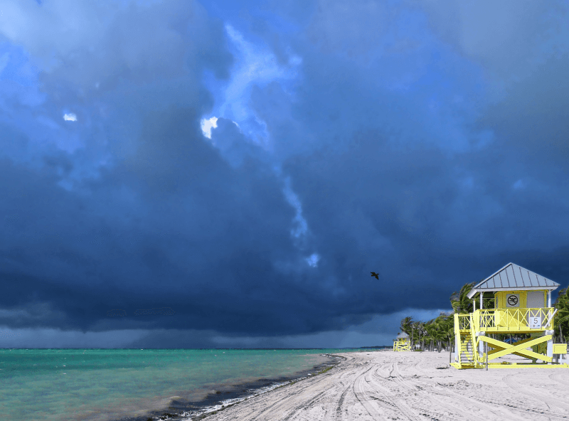 A storm front looms over Crandon Park Beach in Miami-Dade County, Florida.