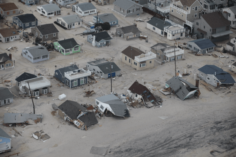 Flooded houses collapse along the beach in Ocean County, New Jersey