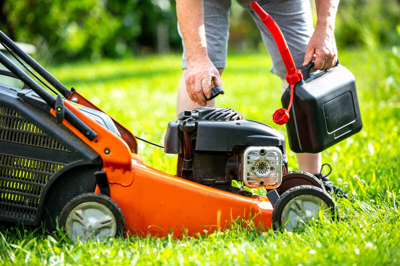 Man refueling the lawnmower