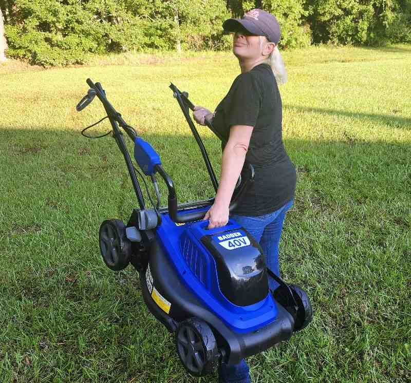 person holding a lawn mower