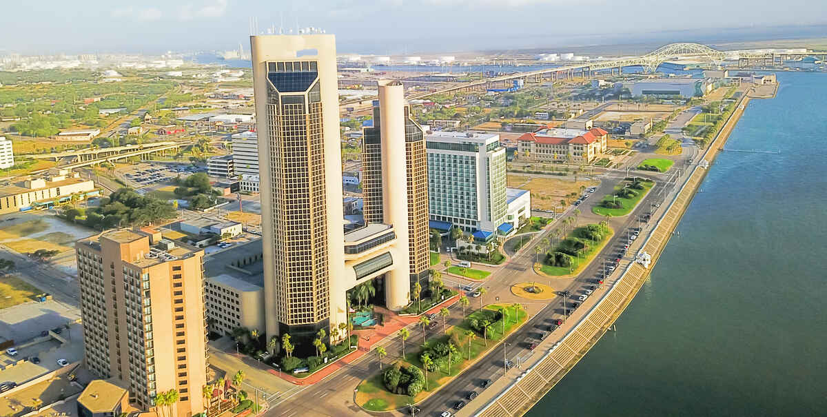 Panorama aerial view Corpus Christi skylines along North Bayfront Park at sunrise.