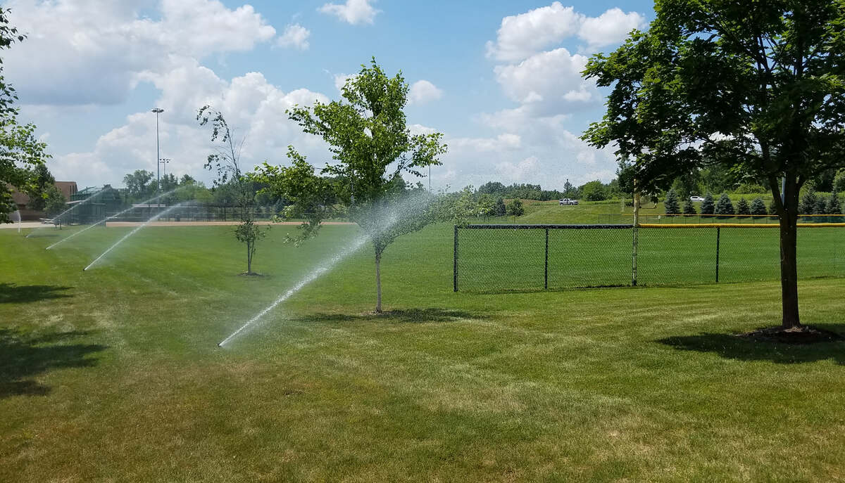 Sprinklers watering grass at Ohio State University in Columbus, Ohio