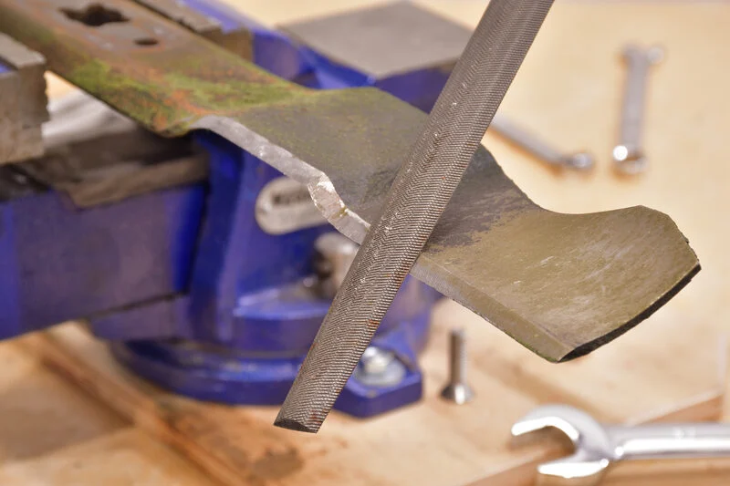 sharpening mower blade with hand file